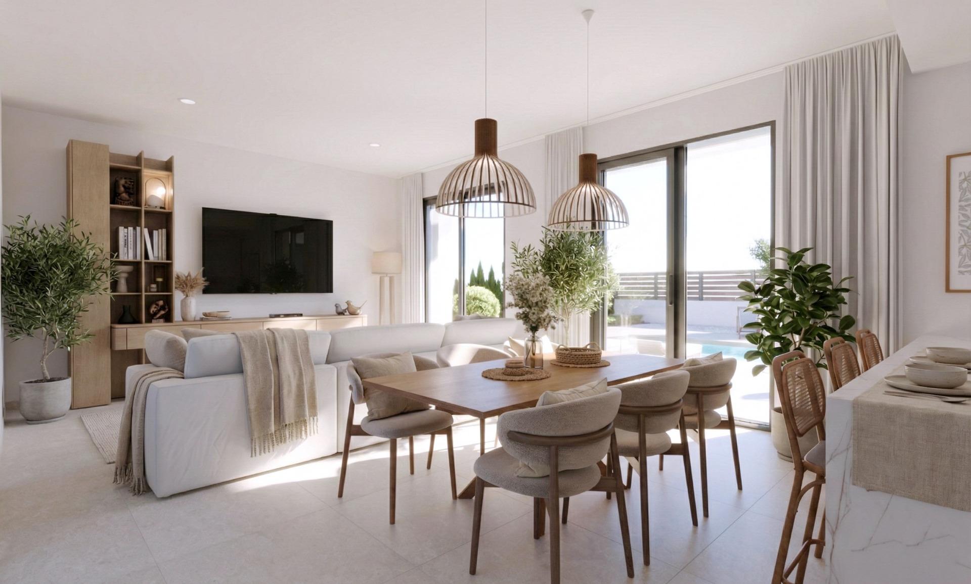 Bright open-plan living and dining area with modern furnishings and natural light in single-storey villa at Hacienda del Álamo Golf Resort Murcia