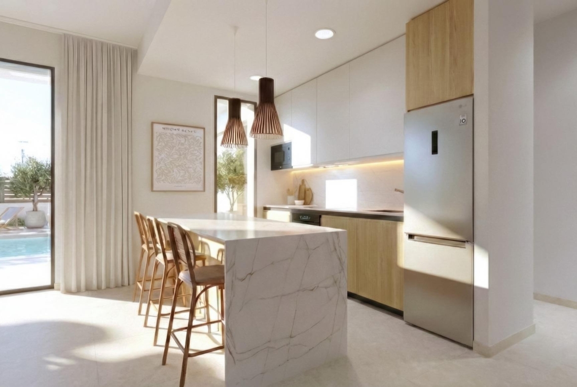 Bright modern kitchen with marble island and wooden accents in single-storey new build villa at Hacienda del Álamo Golf Resort, Murcia