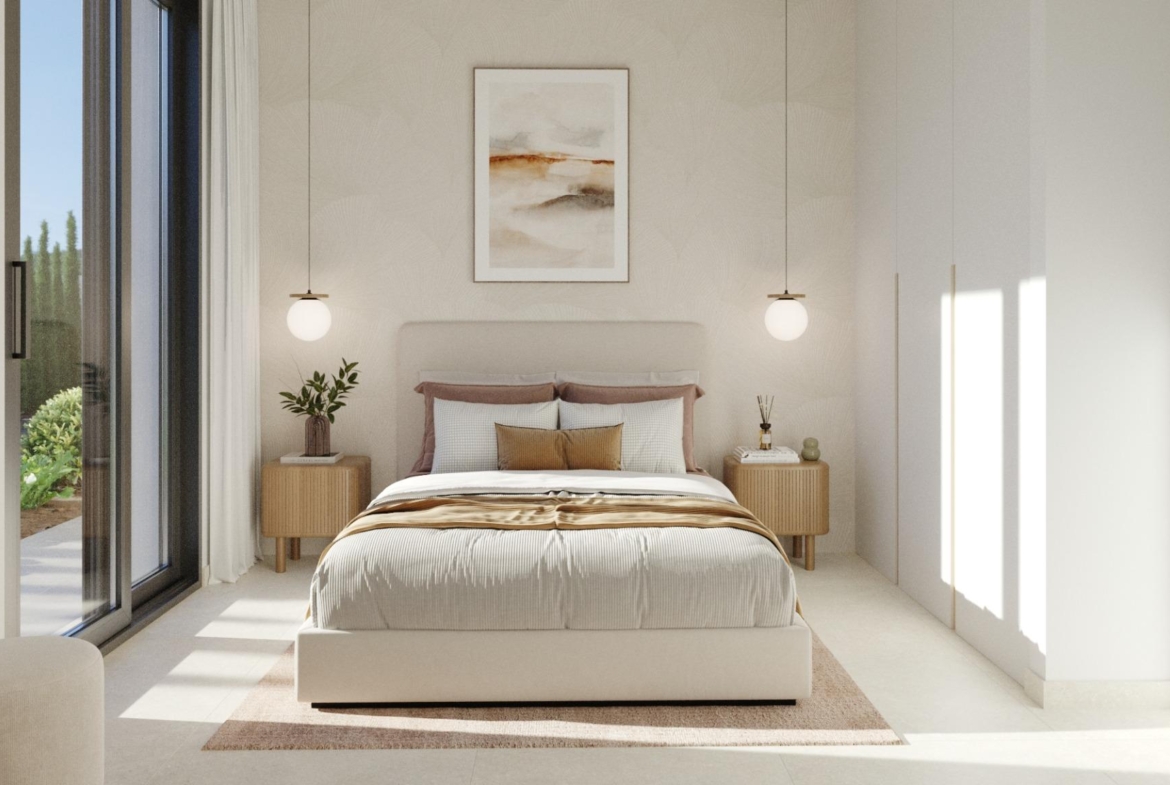 Bright, elegant bedroom with soft textiles, modern lighting, and garden views in a new single-storey villa in Hacienda del Álamo Golf Resort, Murcia.