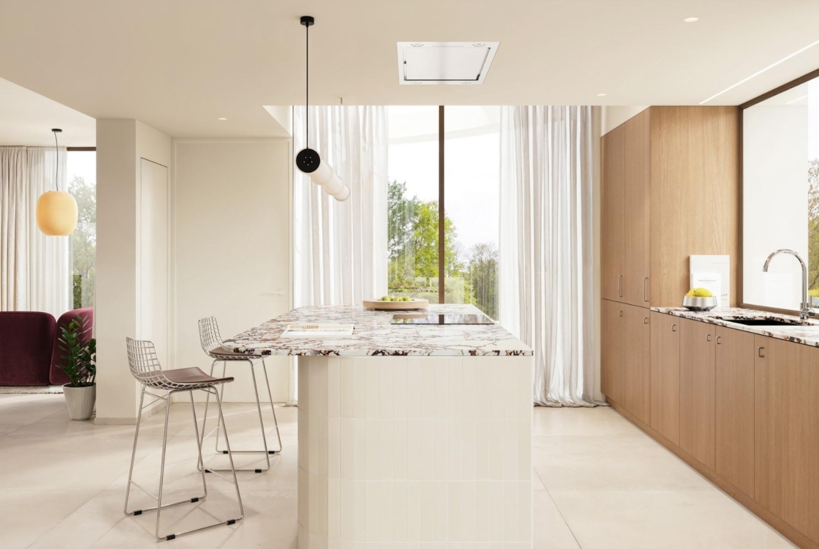 Bright modern kitchen with marble island and sleek wood cabinetry in exclusive Ibiza style villa, Algorfa Costa Blanca.