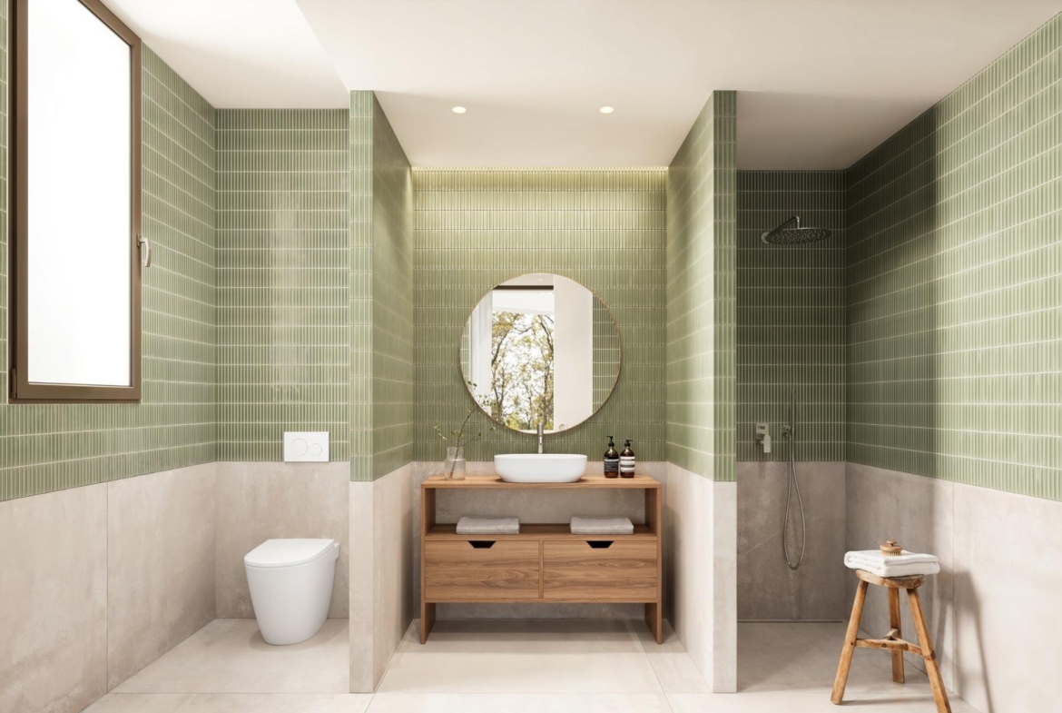 Elegant modern bathroom with green tiled walls and walk-in shower in luxury Ibiza style villa on La Finca Golf, Algorfa.