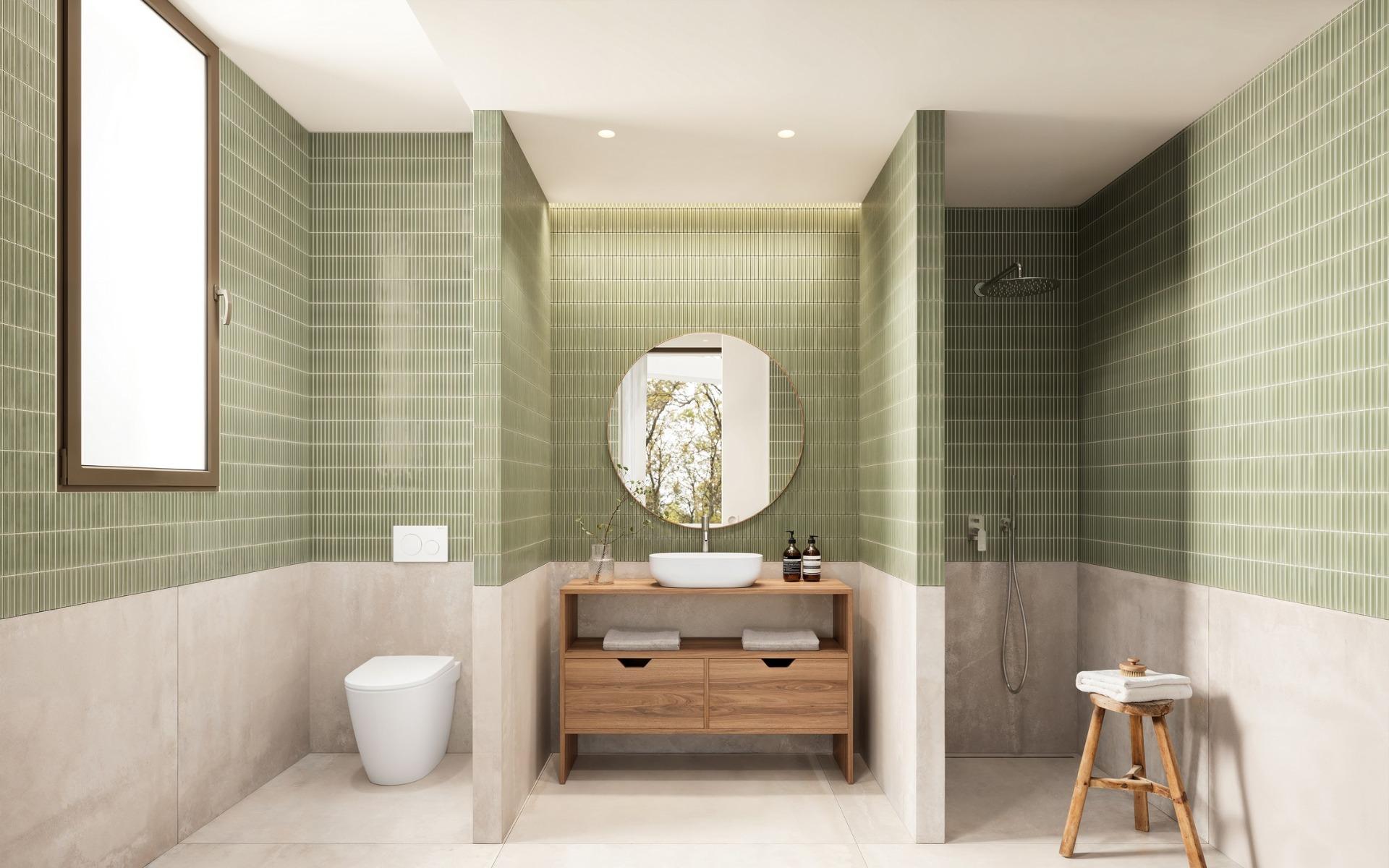 Elegant modern bathroom with green tiled walls and walk-in shower in luxury Ibiza style villa on La Finca Golf, Algorfa.