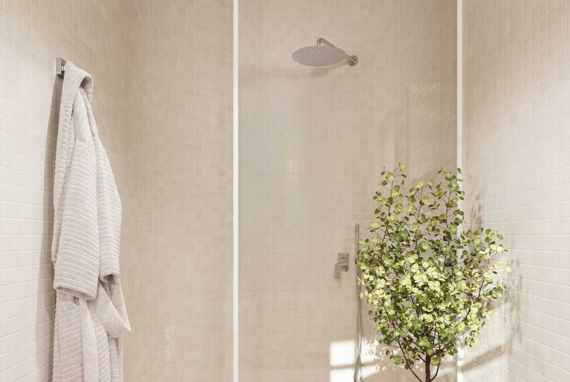Bright, modern bathroom with glass walk-in shower, cozy robes, and elegant decor in 4-bedroom Ibiza style villa, Algorfa Costa Blanca.