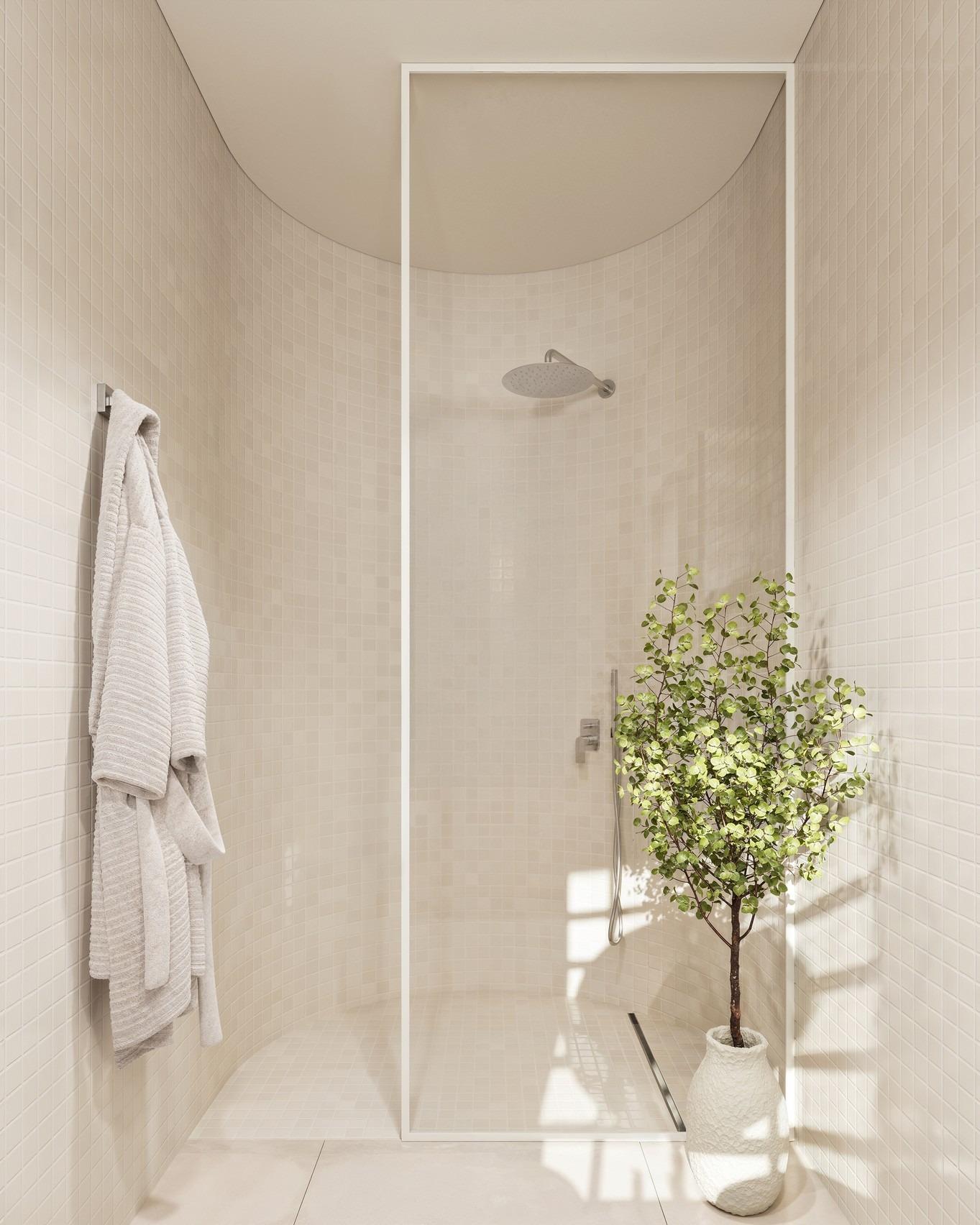 Bright, modern bathroom with glass walk-in shower, cozy robes, and elegant decor in 4-bedroom Ibiza style villa, Algorfa Costa Blanca.