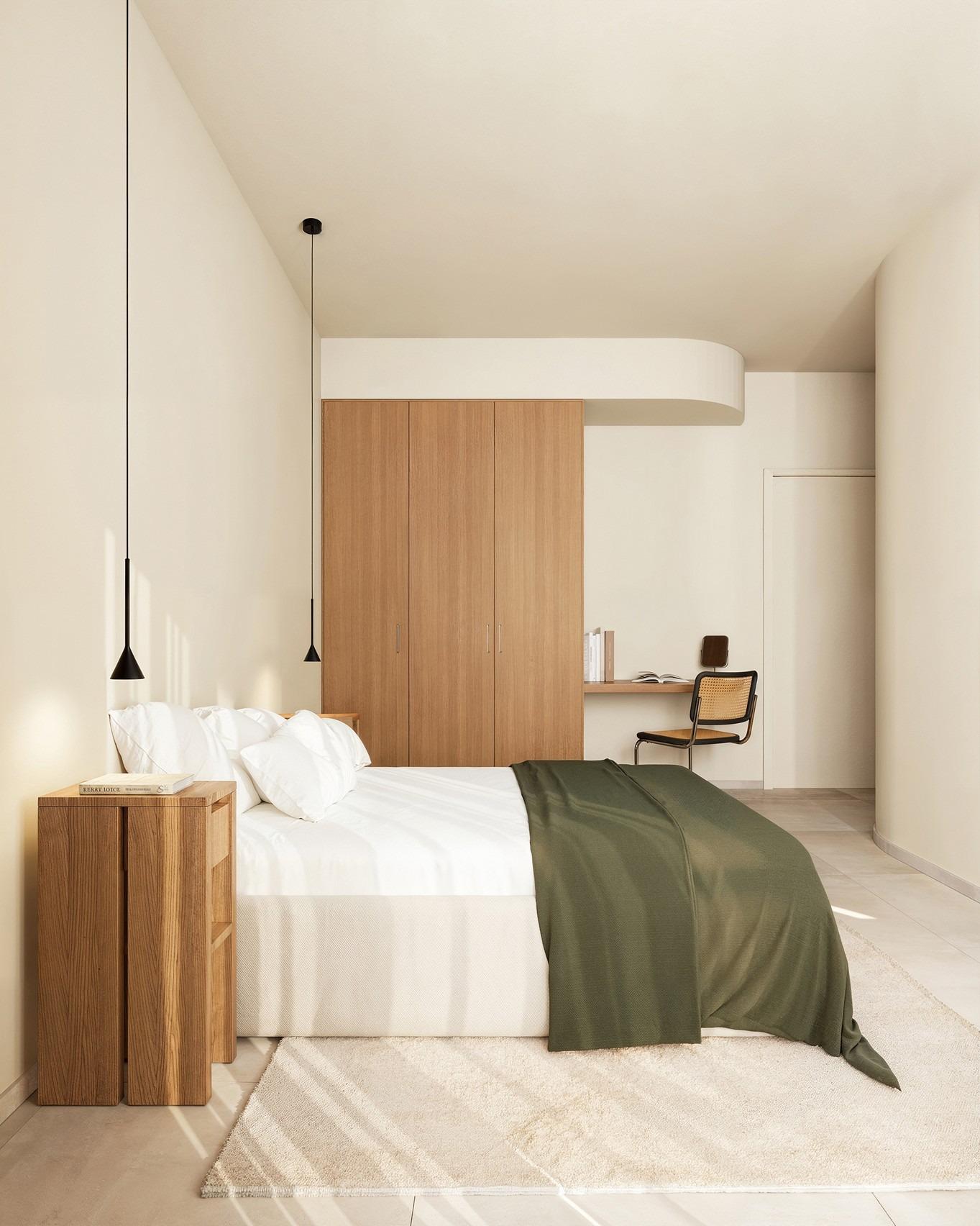Bright, minimalist bedroom with elegant wooden accents in exclusive Ibiza style villa for sale on La Finca Golf, Algorfa.