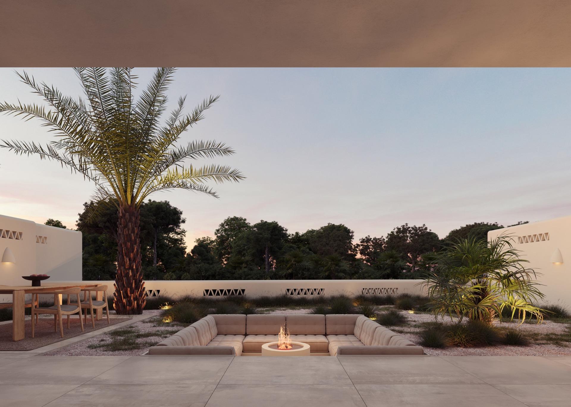 Sun-drenched outdoor lounge with firepit, palm trees, and elegant dining area at Ibiza style villa on La Finca Golf, Costa Blanca.