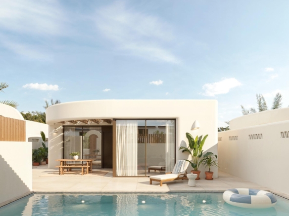 Elegant sun-drenched Ibiza style villa exterior with private pool and minimalist terrace on La Finca Golf, Algorfa, Costa Blanca.
