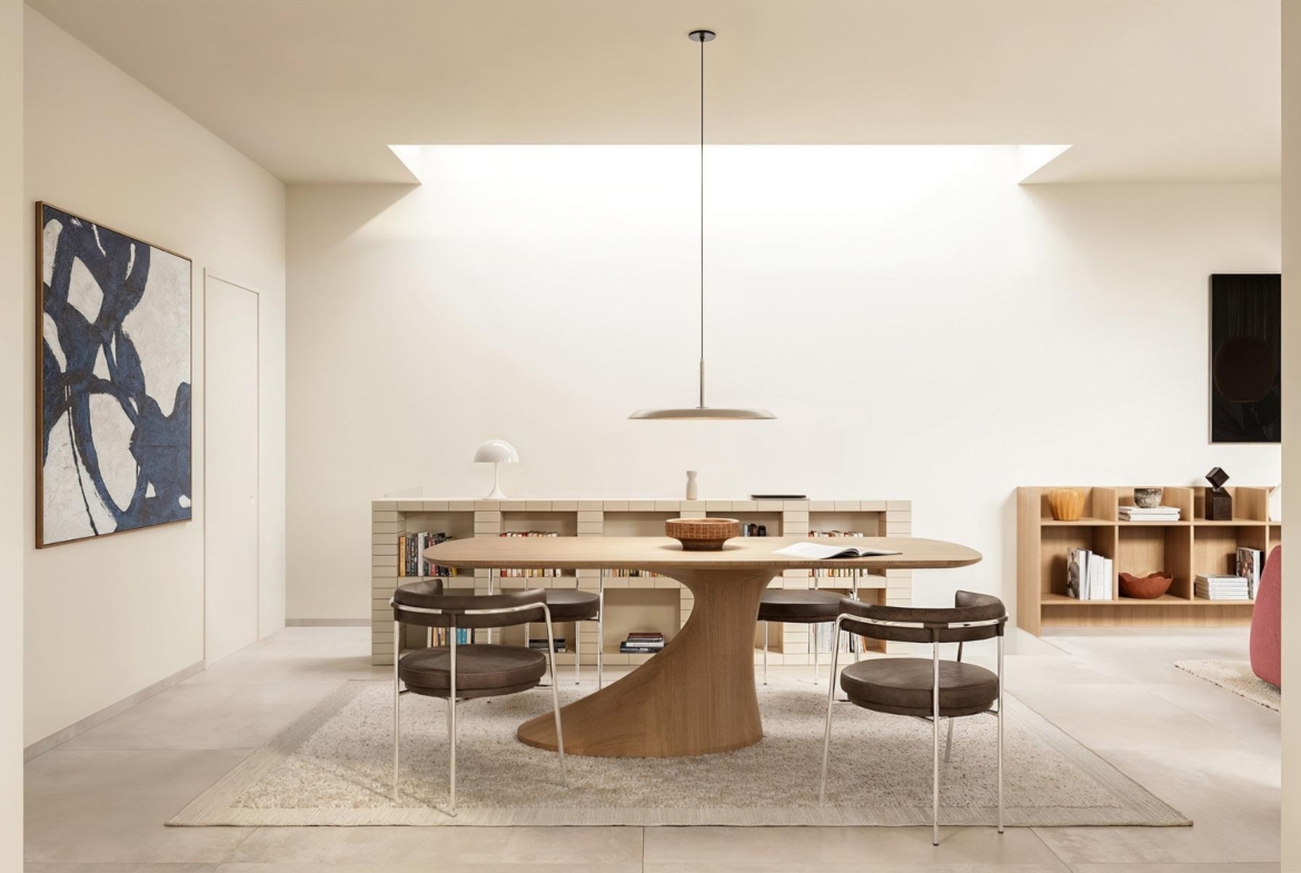 Bright and airy dining area with minimalist wooden table in exclusive Ibiza style 4-bedroom villa in Algorfa, Costa Blanca.