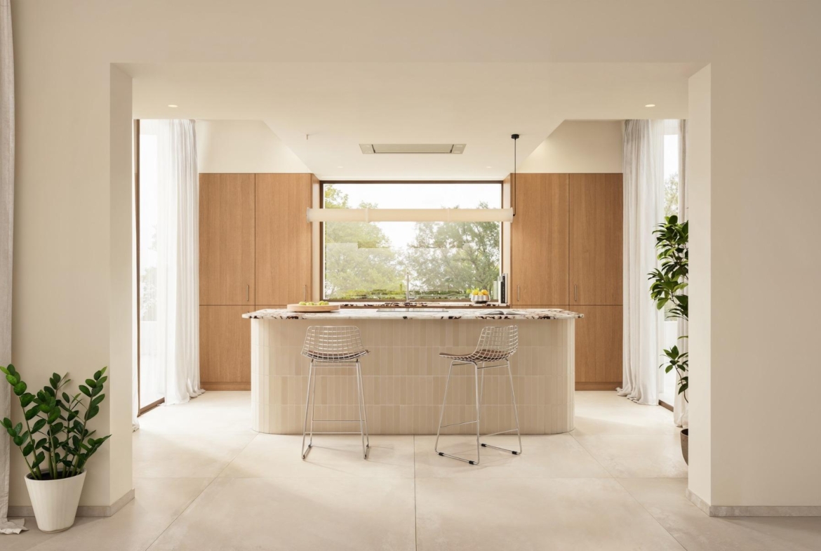 Bright, modern kitchen with sleek island and natural wood accents in a luxury 4-bedroom Ibiza style villa in Algorfa, Costa Blanca.