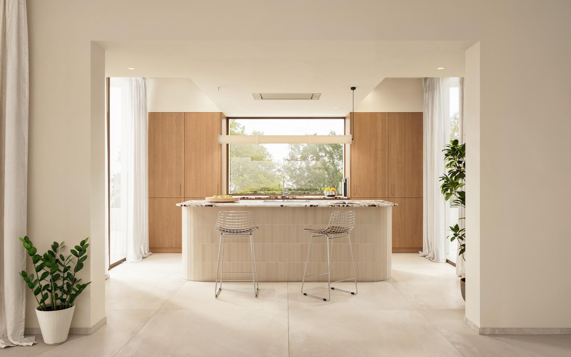 Bright, modern kitchen with sleek island and natural wood accents in a luxury 4-bedroom Ibiza style villa in Algorfa, Costa Blanca.
