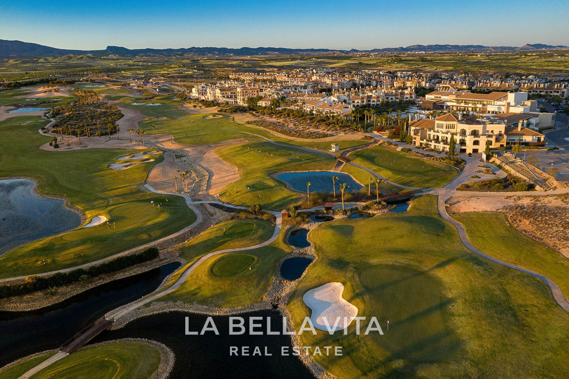 Panoramic sun-drenched golf course and luxury villa developments at Hacienda del Álamo Golf Resort, Murcia.