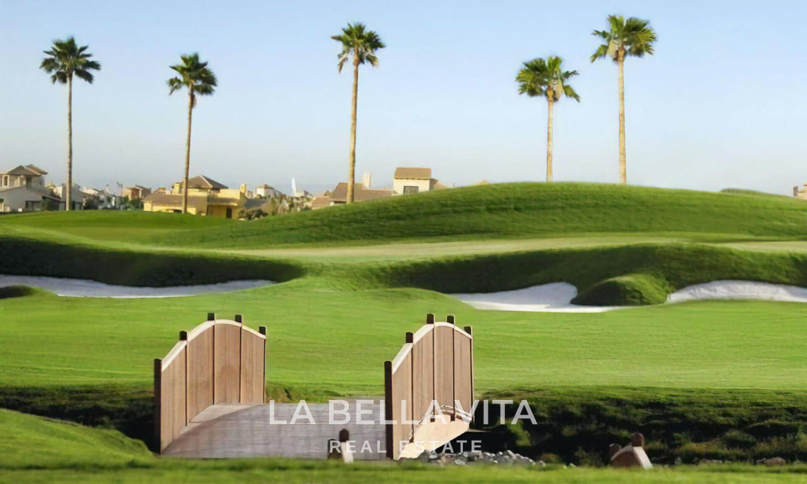 Scenic landscaped golf course view with palm trees near single-storey villa in Hacienda del Álamo Golf Resort, Murcia