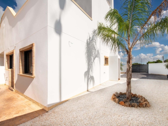 Bright and modern exterior of spacious new build 3-bedroom ground floor bungalow with landscaped courtyard in Cox, Alicante.