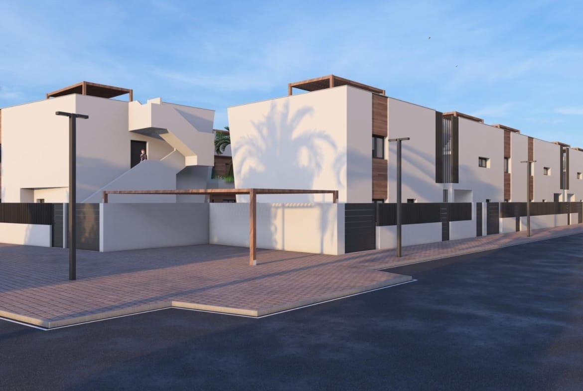 New-Construction-Homes-in-Torre-Pacheco-Costa-Calida-2 Modern white exterior of luxury 3-bedroom penthouse with spacious solarium and pergola in Torre-Pacheco under clear blue sky