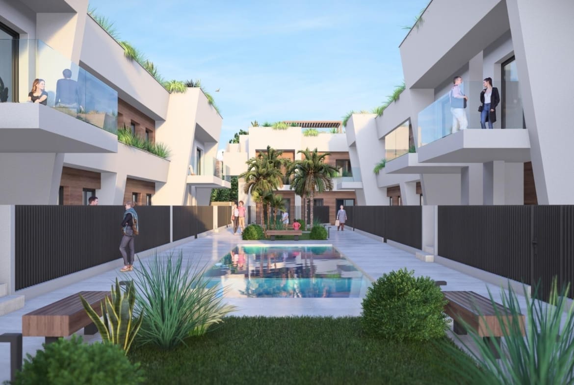 New-Construction-Homes-in-Torre-Pacheco-Costa-Calida-4 Modern luxury penthouse complex in Torre-Pacheco featuring a sleek pool, landscaped gardens, and spacious sunlit terraces.