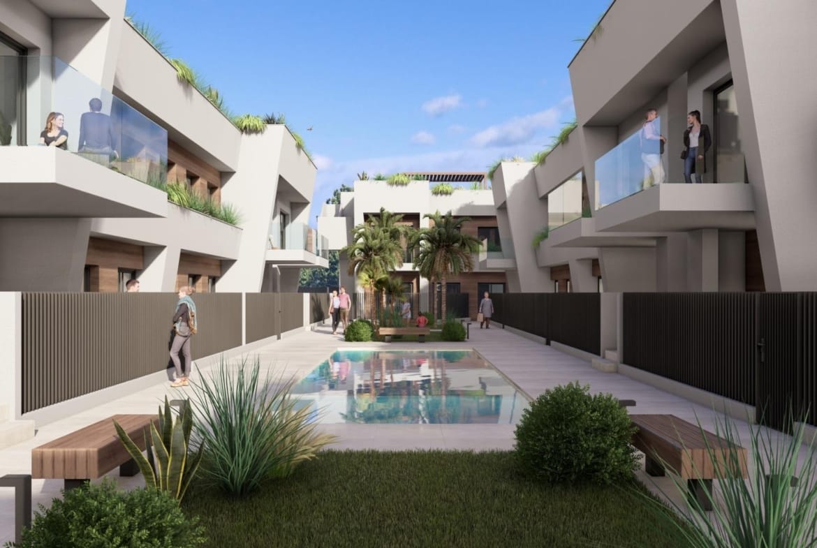 New-Construction-Homes-in-Torre-Pacheco-Costa-Calida-5 Modern luxury penthouse complex in Torre-Pacheco featuring sleek balconies, landscaped courtyard, and pristine central pool area.