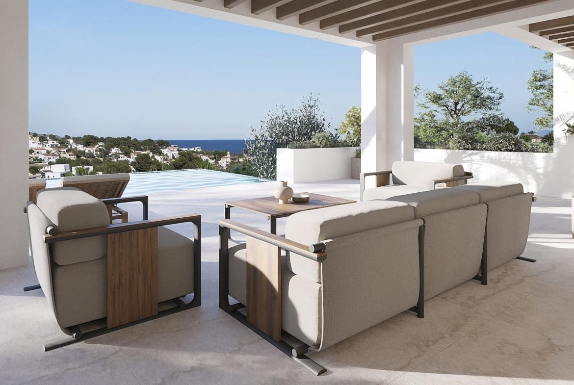 Elegant covered terrace with modern outdoor seating, infinity pool, and panoramic sea views at luxury 4-bedroom Ibizan villa in La Fustera, Benissa.