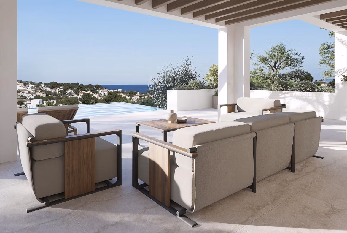 Elegant covered terrace with modern outdoor seating, infinity pool, and panoramic sea views at luxury 4-bedroom Ibizan villa in La Fustera, Benissa.