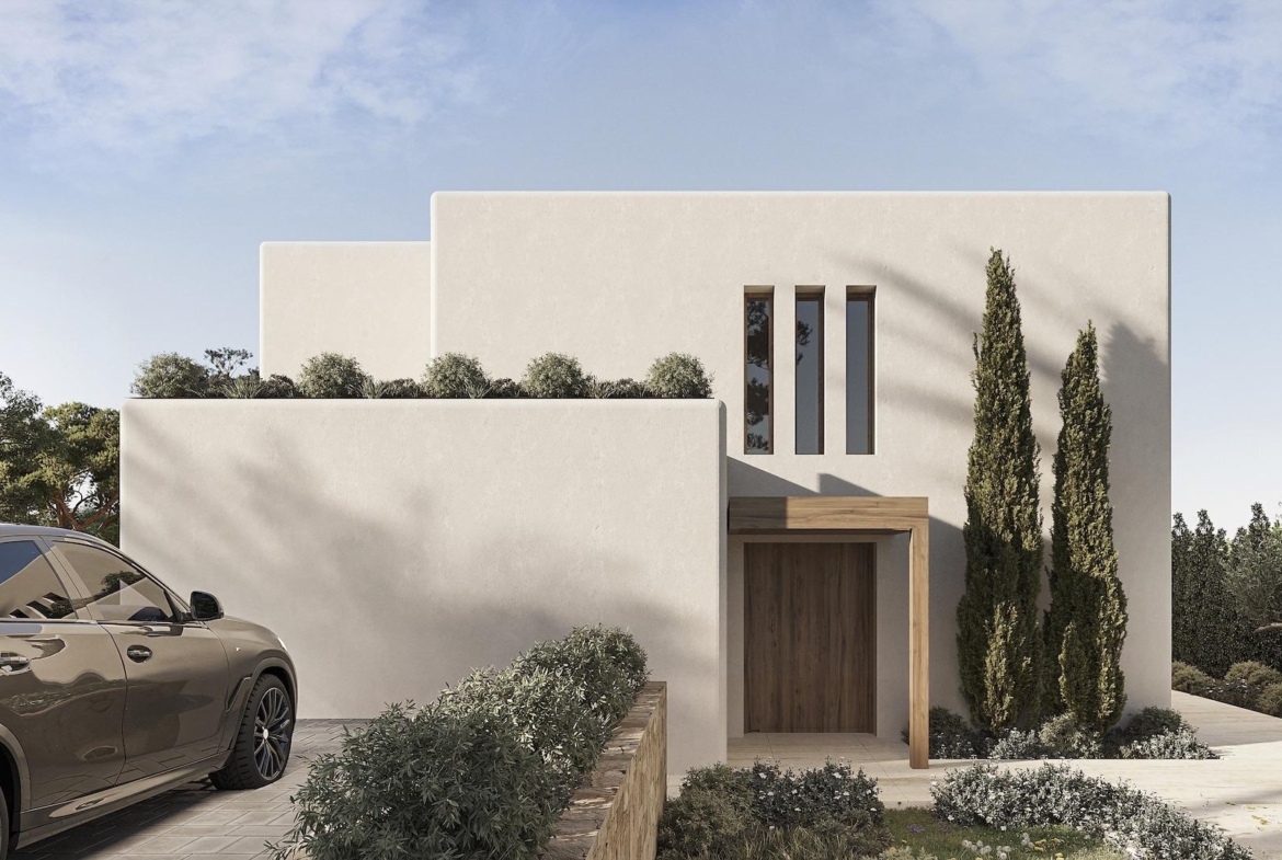 Modern luxury Ibizan villa facade with clean lines, lush landscaping, and private driveway in La Fustera, Benissa