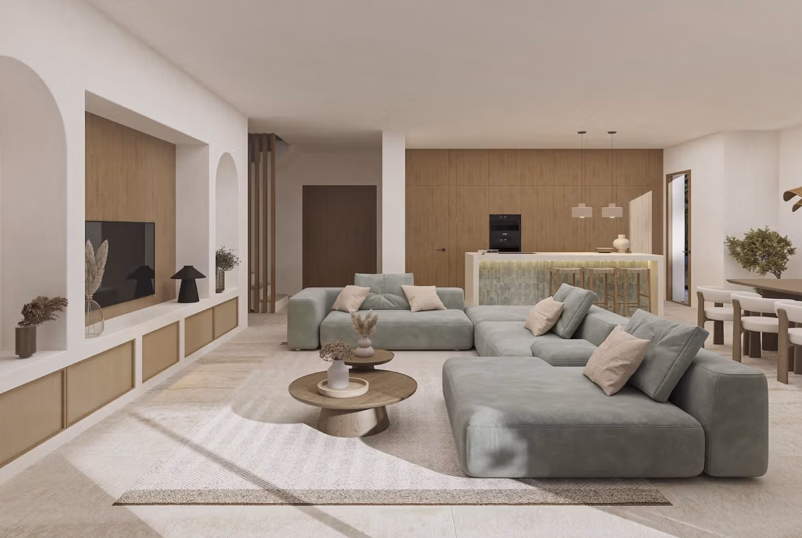 Bright, elegant open-plan living room with modern kitchen and dining area in a luxury 4-bedroom Ibizan villa in La Fustera, Benissa.