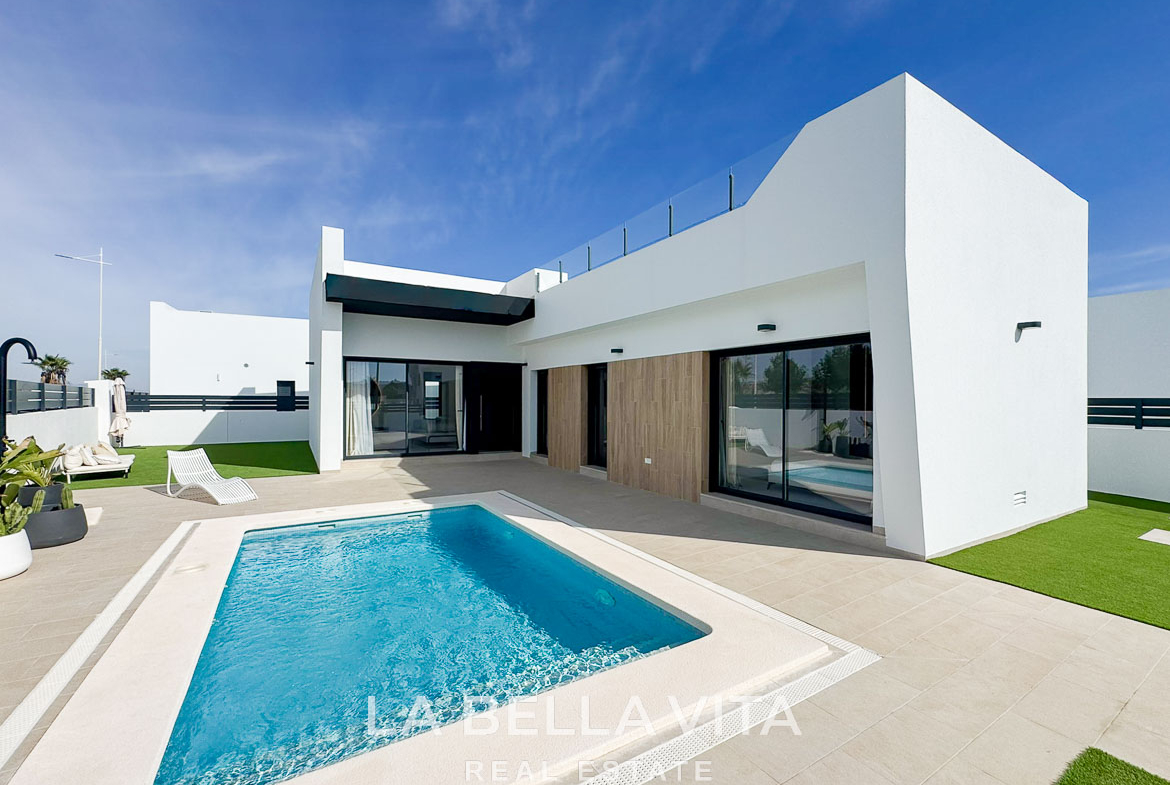 Stunning modern 3-bedroom villa in San Miguel de Salinas with a private pool, sleek terrace, and minimalist white exterior.