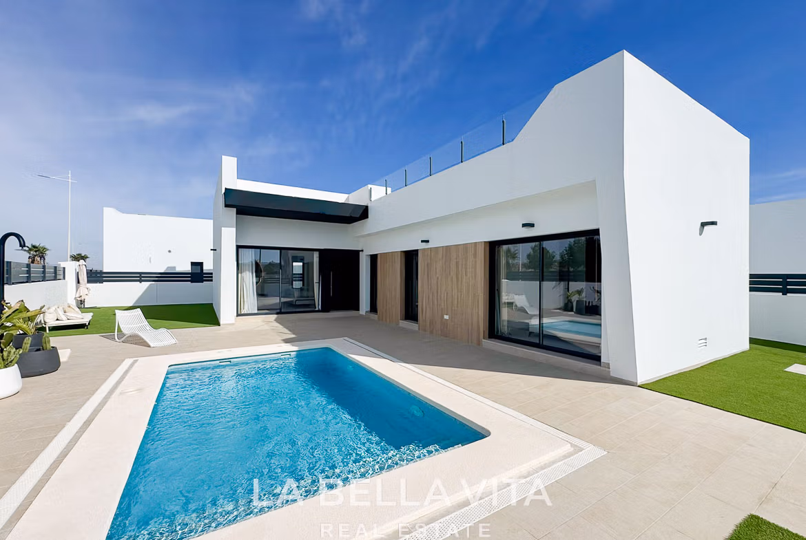 Stunning modern 3-bedroom villa in San Miguel de Salinas with a private pool, sleek terrace, and minimalist white exterior.