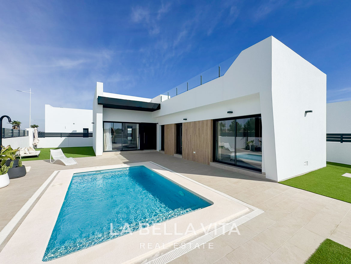 Stunning modern 3-bedroom villa in San Miguel de Salinas with a private pool, sleek terrace, and minimalist white exterior.