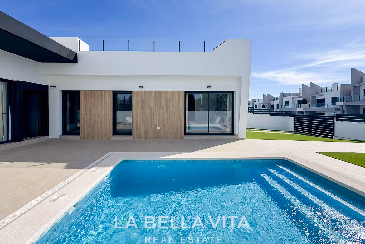 Modern 3-bedroom villa in San Miguel de Salinas with sleek exterior, private sparkling pool, and spacious sunlit terrace