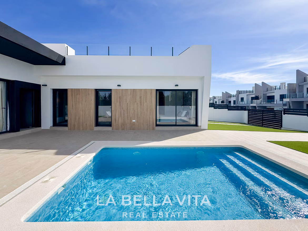 Modern 3-bedroom villa in San Miguel de Salinas with sleek exterior, private sparkling pool, and spacious sunlit terrace