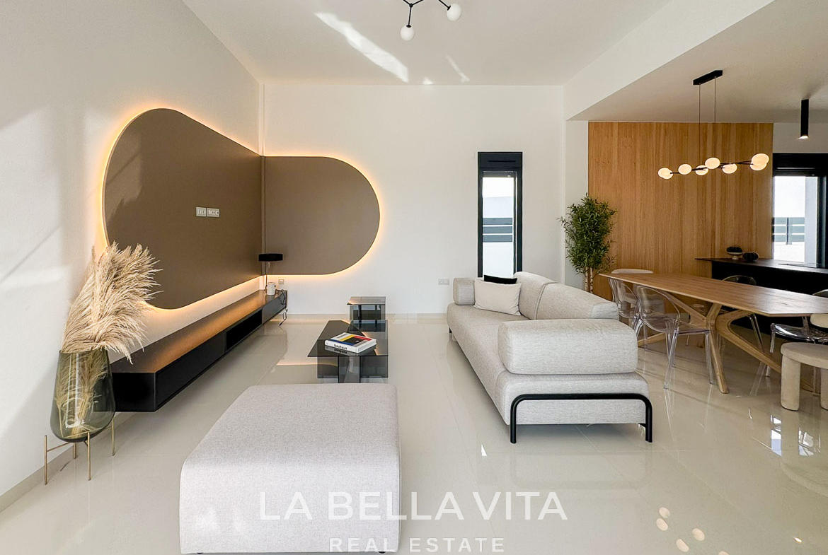 Bright, modern open-plan living and dining area in a sleek 3-bedroom villa with elegant design in San Miguel de Salinas.