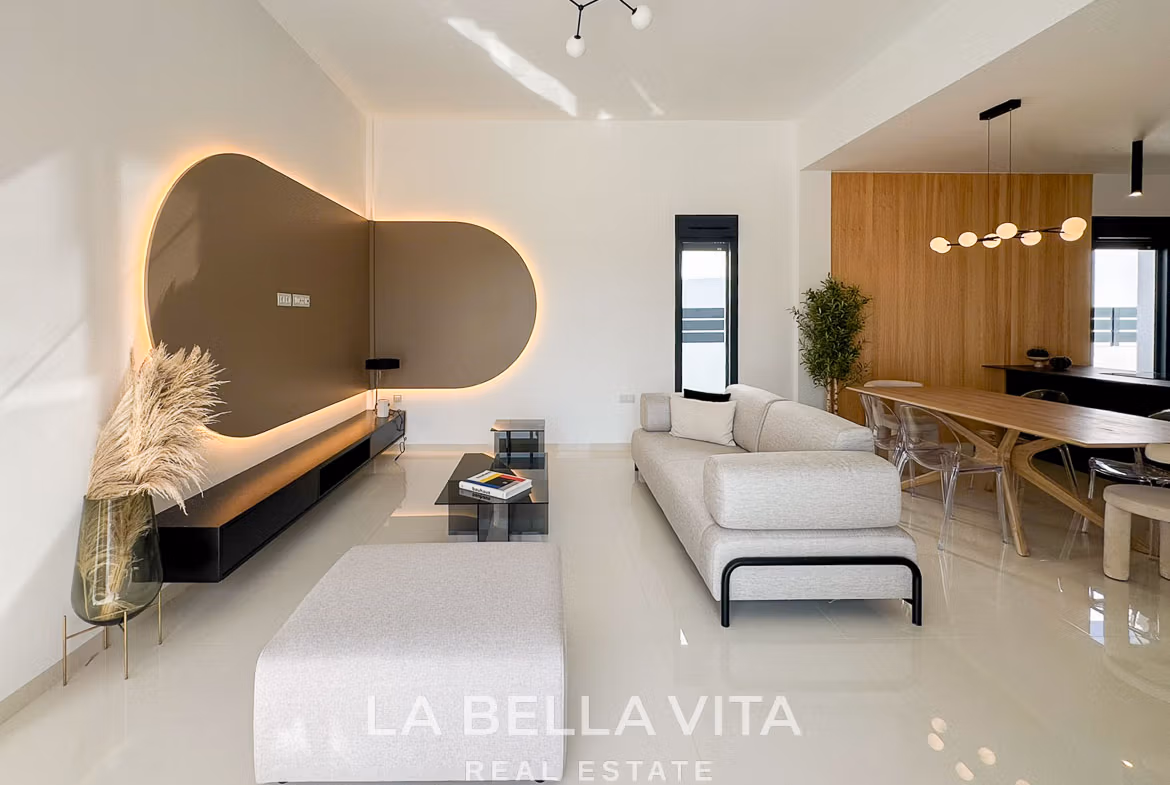 Bright, modern open-plan living and dining area in a sleek 3-bedroom villa with elegant design in San Miguel de Salinas.