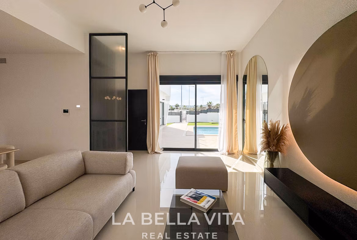Bright, modern living room in a 3-bedroom villa in San Miguel de Salinas with sleek design and views of private pool and terrace