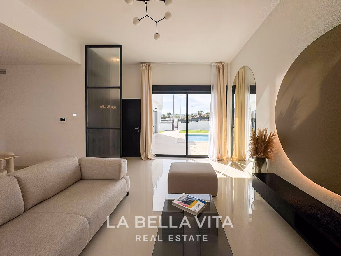 Bright, modern living room in a 3-bedroom villa in San Miguel de Salinas with sleek design and views of private pool and terrace