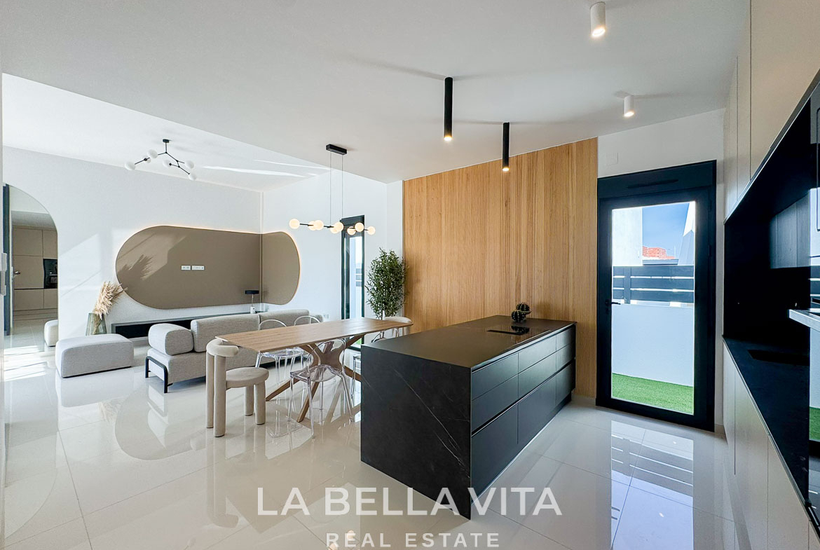 Bright modern open-plan kitchen and living area in a 3-bedroom villa with sleek design in San Miguel de Salinas.
