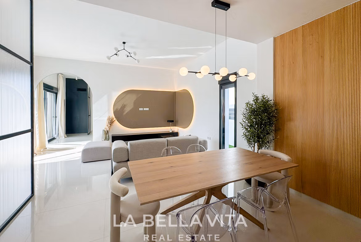 Bright modern open-plan dining and living area in luxury 3-bedroom villa with elegant design in San Miguel de Salinas