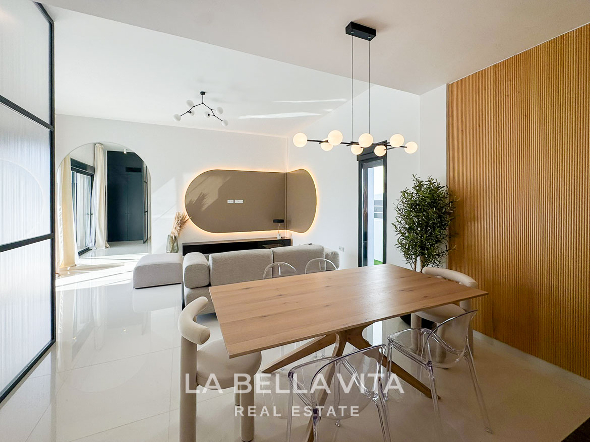 Bright modern open-plan dining and living area in luxury 3-bedroom villa with elegant design in San Miguel de Salinas
