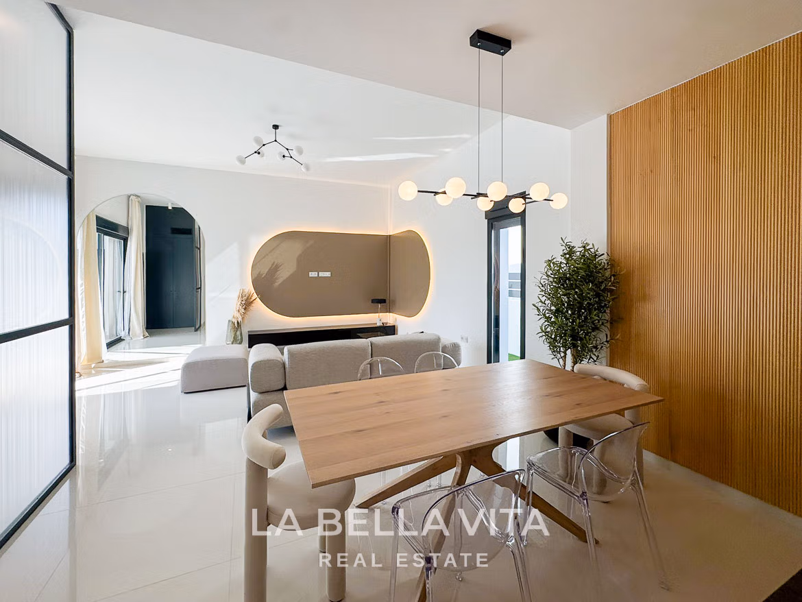 Bright modern open-plan dining and living area in luxury 3-bedroom villa with elegant design in San Miguel de Salinas