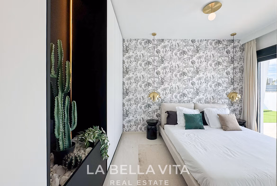 Bright modern bedroom with botanical wallpaper and plush bedding in luxury 3 bedroom villa in San Miguel de Salinas