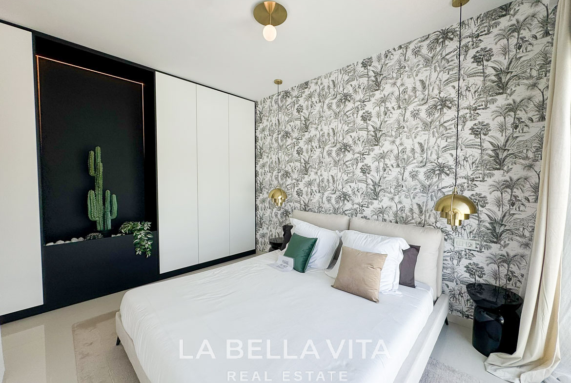 Bright and elegant bedroom with botanical wallpaper and modern accents in a 3-bedroom villa, San Miguel de Salinas.