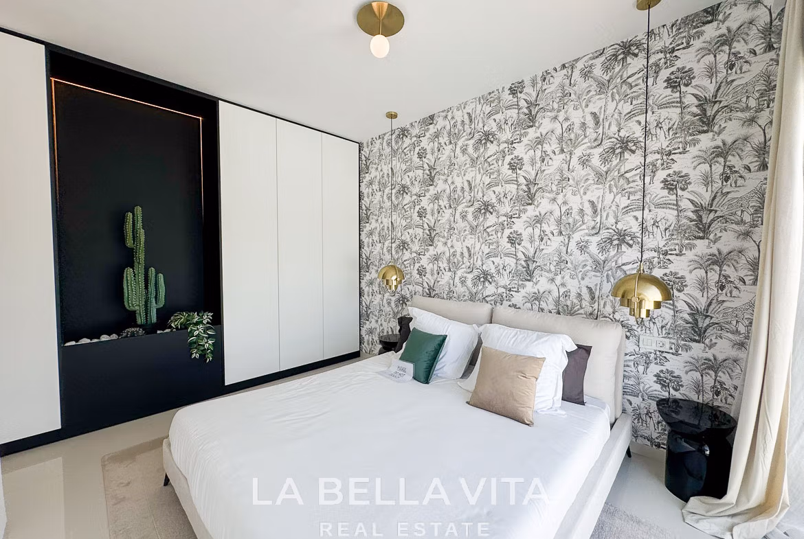 Bright and elegant bedroom with botanical wallpaper and modern accents in a 3-bedroom villa, San Miguel de Salinas.