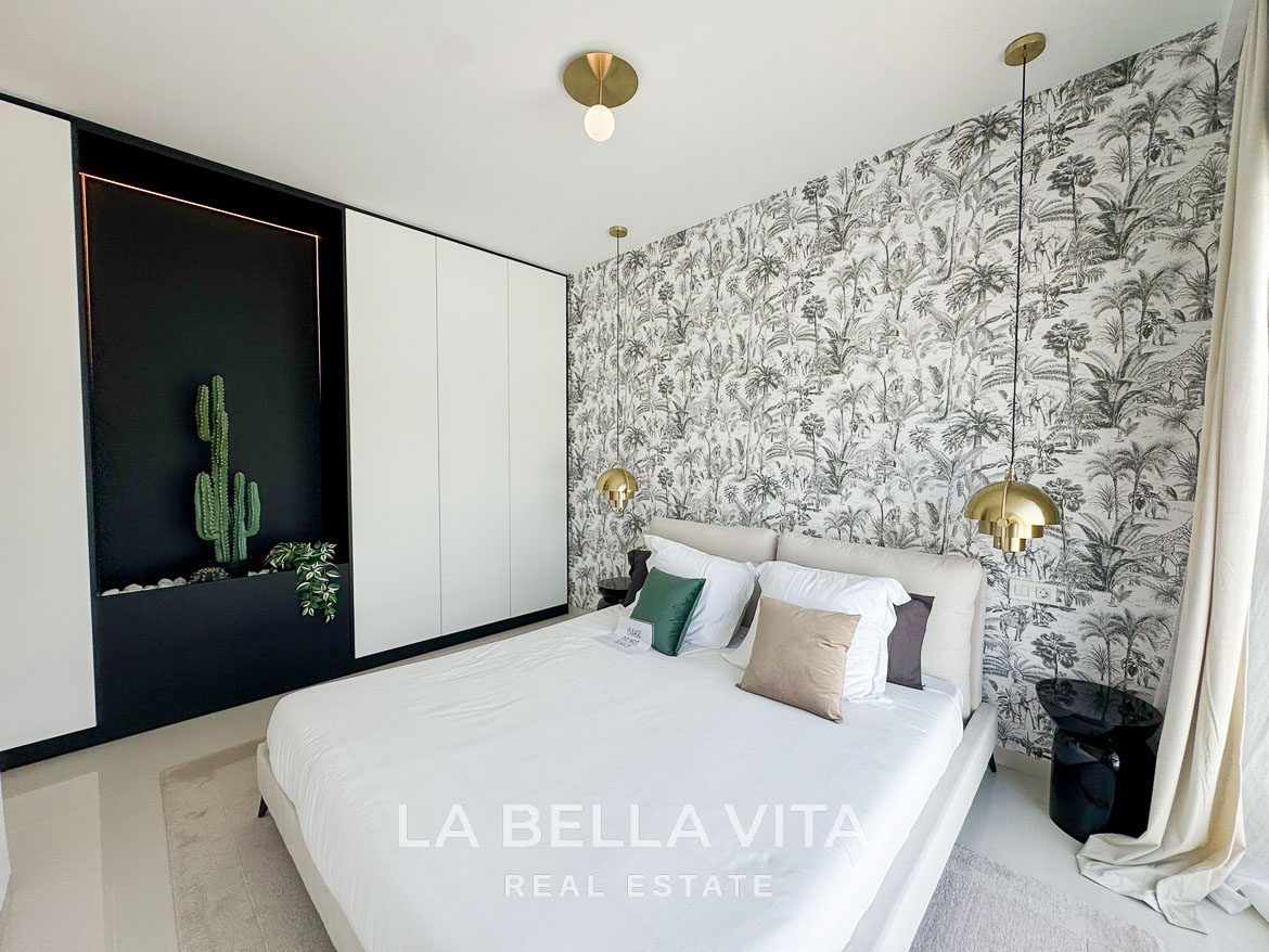 Bright and elegant bedroom with botanical wallpaper and modern accents in a 3-bedroom villa, San Miguel de Salinas.