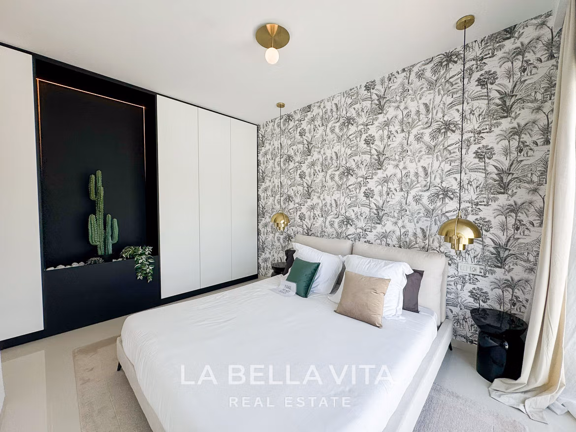 Bright and elegant bedroom with botanical wallpaper and modern accents in a 3-bedroom villa, San Miguel de Salinas.