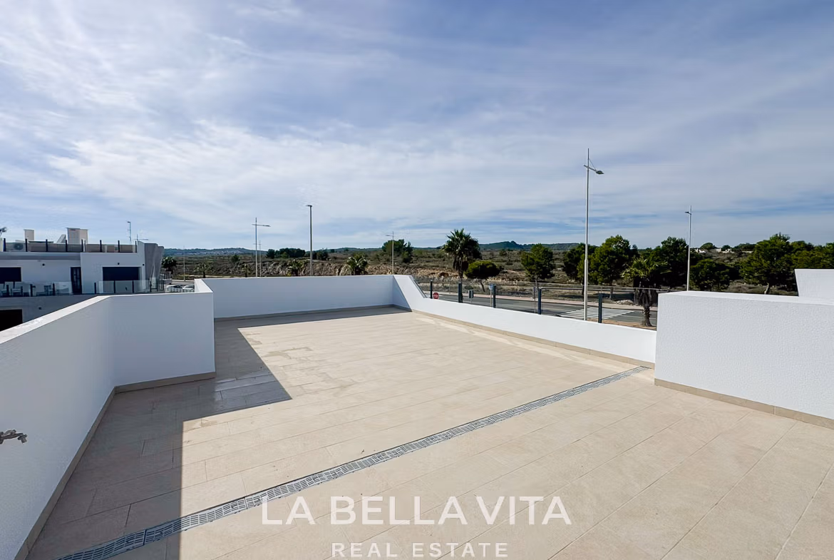 Spacious sun-drenched solarium with sleek tiled flooring in modern 3-bedroom villa for sale in San Miguel de Salinas