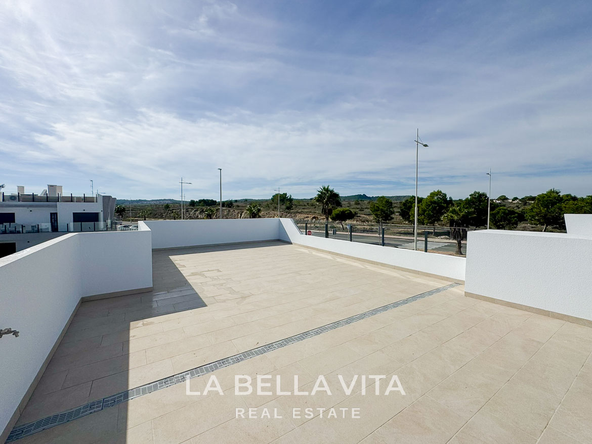 Spacious sun-drenched solarium with sleek tiled flooring in modern 3-bedroom villa for sale in San Miguel de Salinas