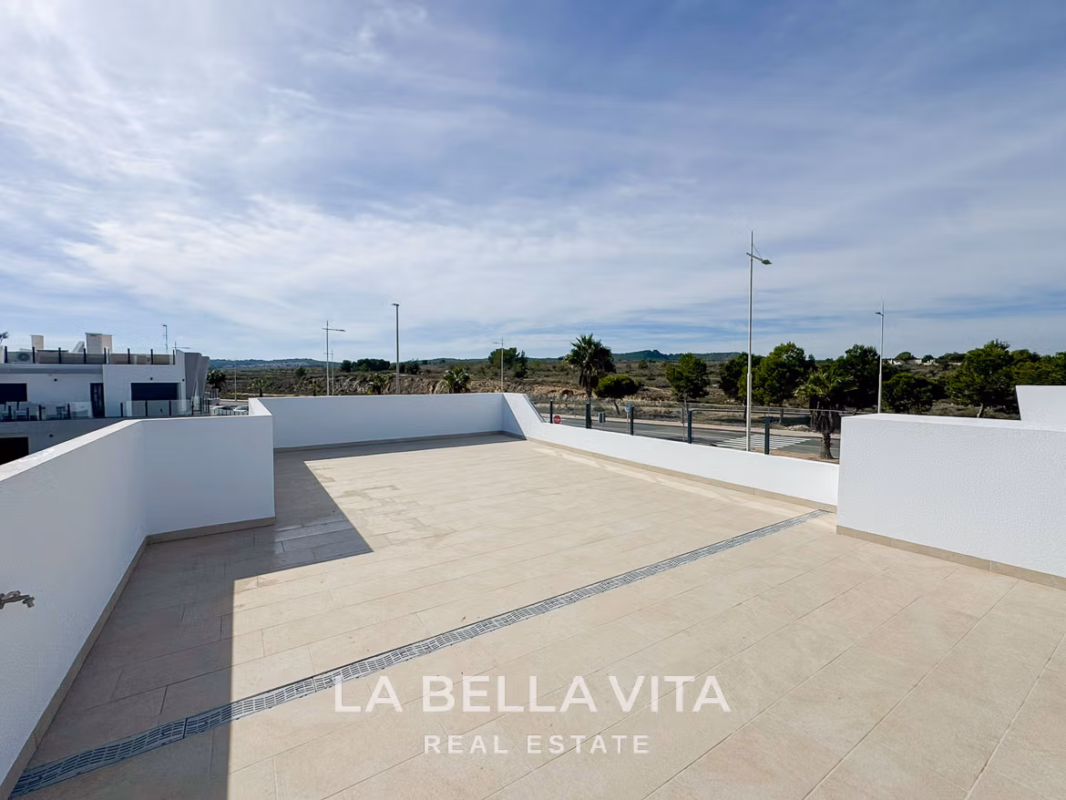 Spacious sun-drenched solarium with sleek tiled flooring in modern 3-bedroom villa for sale in San Miguel de Salinas