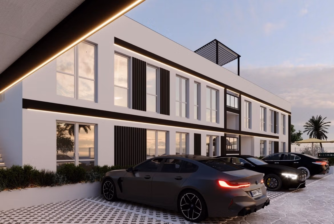 Tourist-Licensed-New-Build-Apartments-in-Finestrat-Investment-Opportunity-Near-Golf-and-Benidorm-1 Modern sleek exterior of smart new build 1 bedroom apartment in Finestrat, Benidorm with stylish parking area at dusk