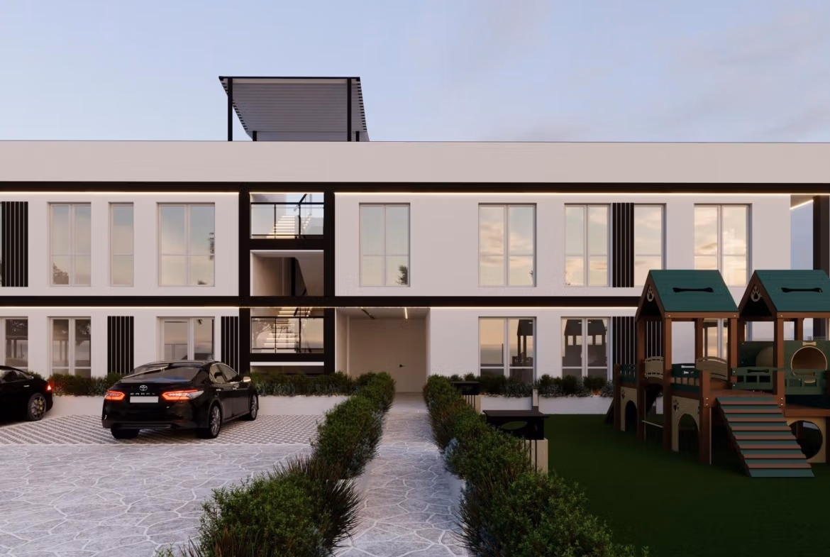 Tourist Licensed New Build Apartments in Finestrat: Investment Opportunity Near Golf and Benidorm Modern smart new build 1-bedroom apartment exterior in Finestrat, Benidorm with sleek parking and landscaped playground area.