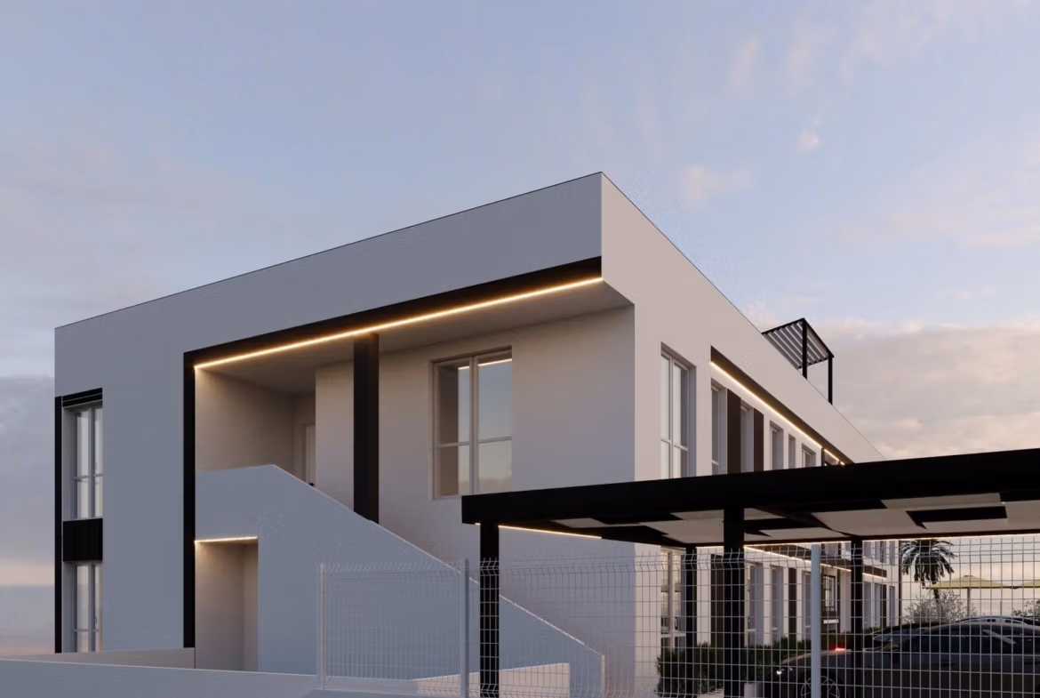 Tourist-Licensed-New-Build-Apartments-in-Finestrat-Investment-Opportunity-Near-Golf-and-Benidorm-5 Modern smart new build 1-bedroom apartment exterior in Finestrat, Benidorm, with sleek lines and ambient lighting at dusk