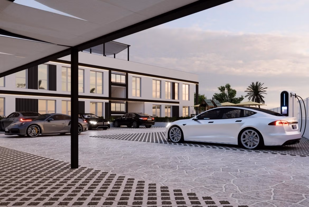 Tourist-Licensed-New-Build-Apartments-in-Finestrat-Investment-Opportunity-Near-Golf-and-Benidorm-9 Modern luxury new build 1 bedroom apartment in Finestrat, Benidorm featuring sleek electric vehicle charging station and stylish exterior parking.
