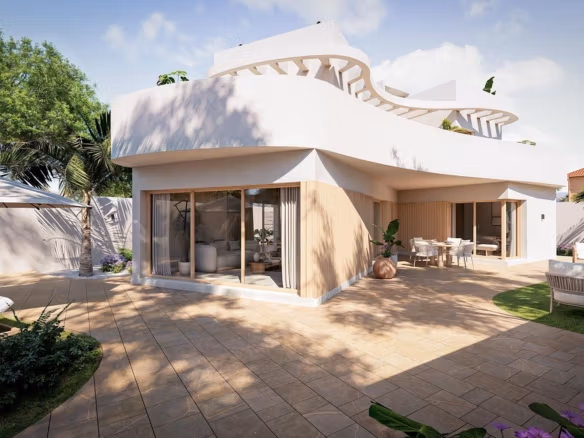 Modern luxury 3-bedroom villa in Orihuela Costa with spacious sunlit terrace, garden seating, and lush tropical landscaping